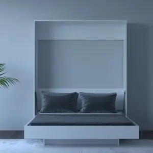 A modern white Murphy bed with a grey mattress and pillows folded down into a vertical position, resembling a cabinet.