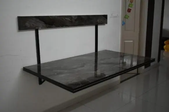 Save space with this foldable dining table that can be mounted on the wall when not in use.