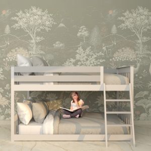 Modern wooden bunk bed for kids with a built-in ladder, featuring a stylish twin over twin design in a cozy bedroom setting. A young girl sits on the lower bunk reading a book, adding a warm and inviting touch.